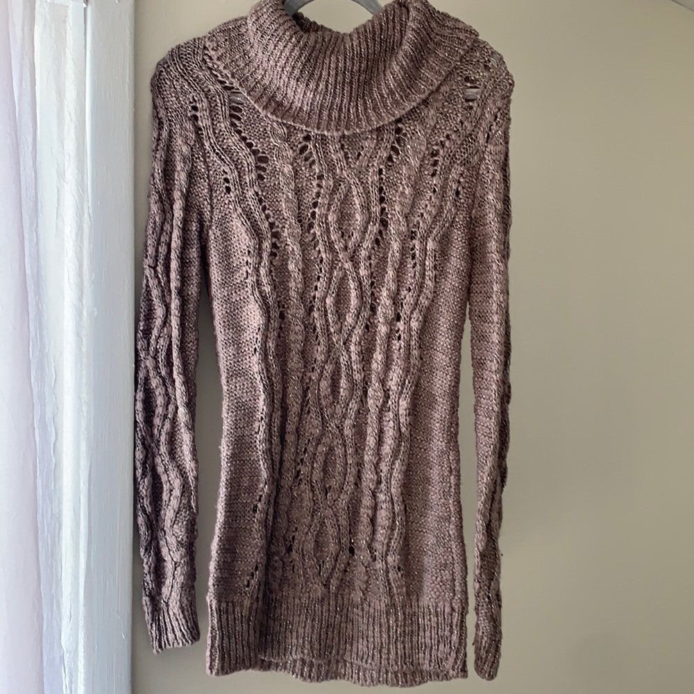 Knit long turtleneck sweater.